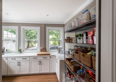 kitchen with open pantry shelves designed by Mary Donaruma